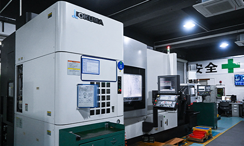 Five-axis machining process cutting a precision metal component